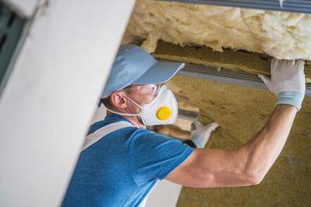technician installing duct attic insullation